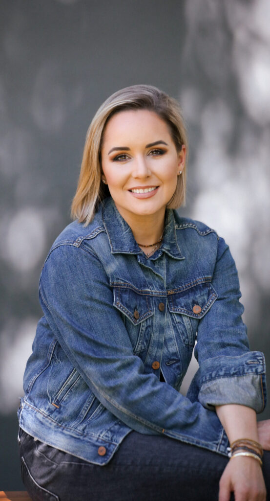 A headshot of a woman smiling.