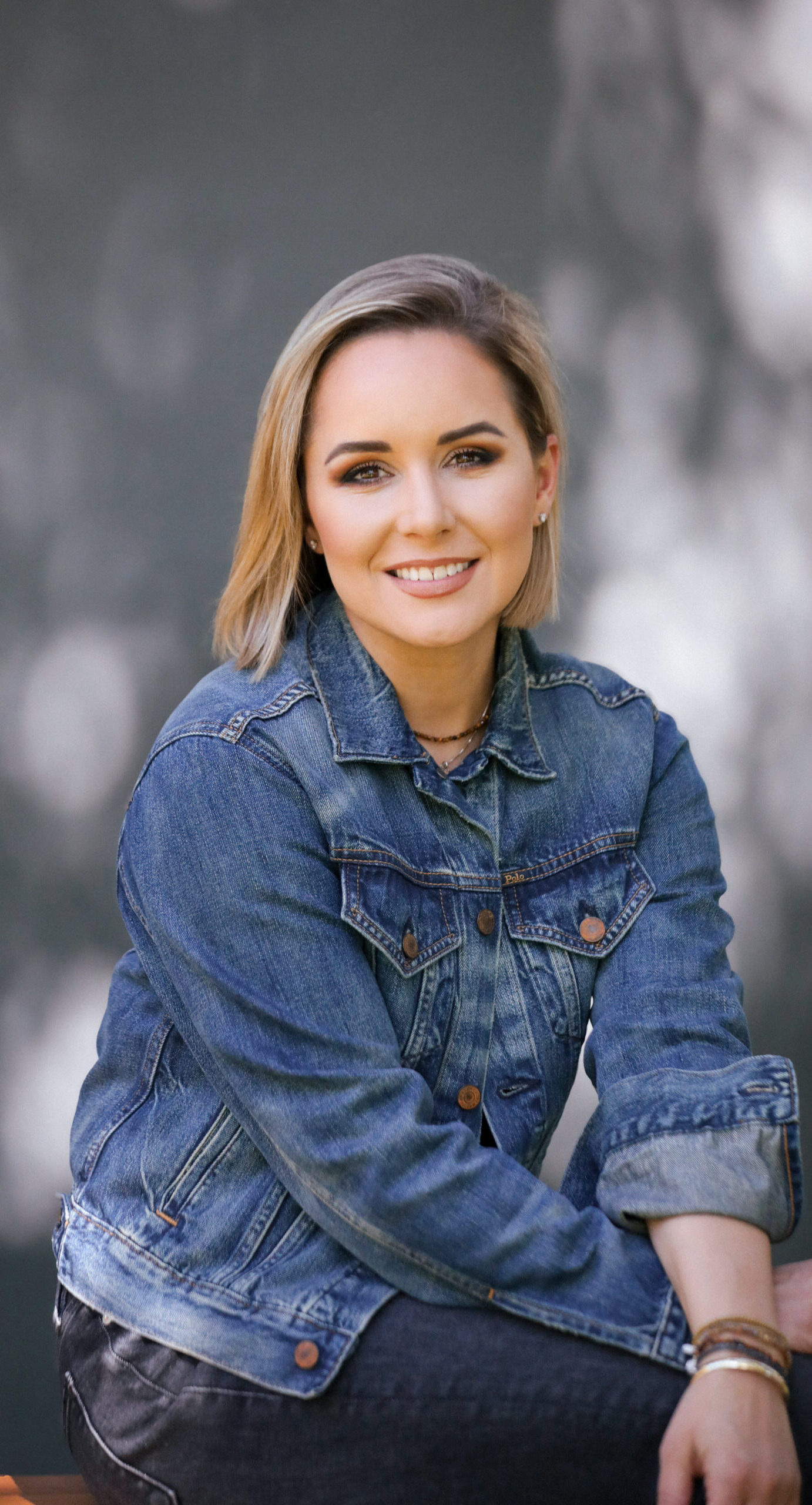 A headshot of a woman smiling.