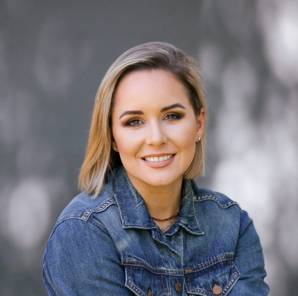 A headshot of a woman smiling.